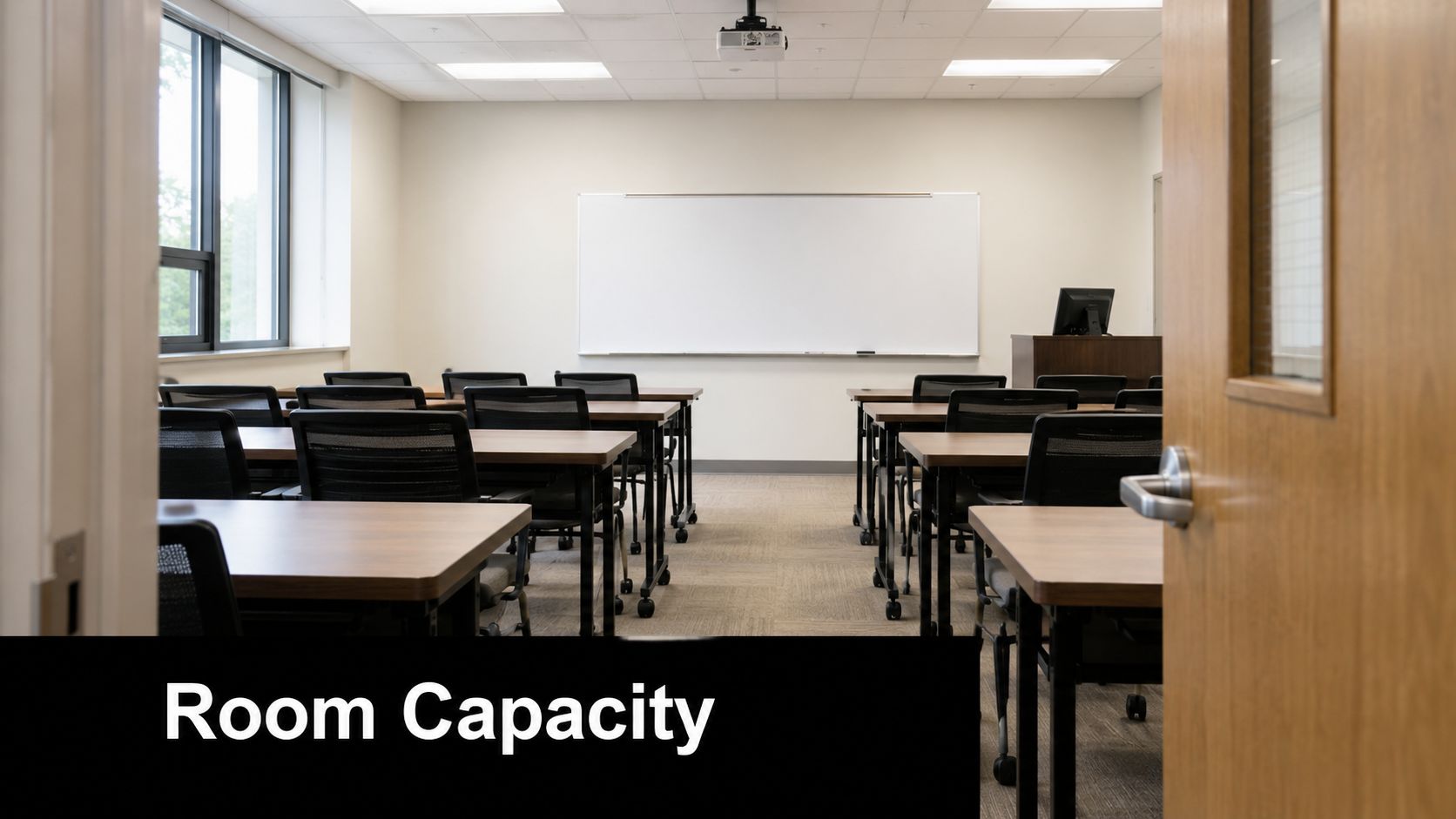 A view through a partially opened door into an empty classroom with rows of desks and chairs.