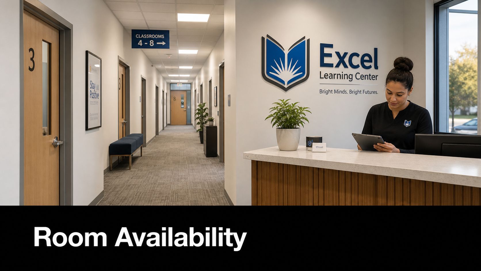 A receptionist working at the front desk of the professional Excel Learning Center office facility.