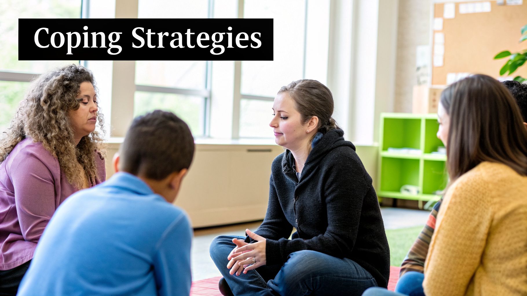 A diverse group of adults and children sitting in a circle, discussing coping strategies in a supportive session.